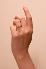 Load image into Gallery viewer, Lab Grown Diamonds Beautifully crafted in 9 carat yellow gold and set with a brilliant lab grown diamond centre stone framed by a halo of pavé set diamonds shown on hand.